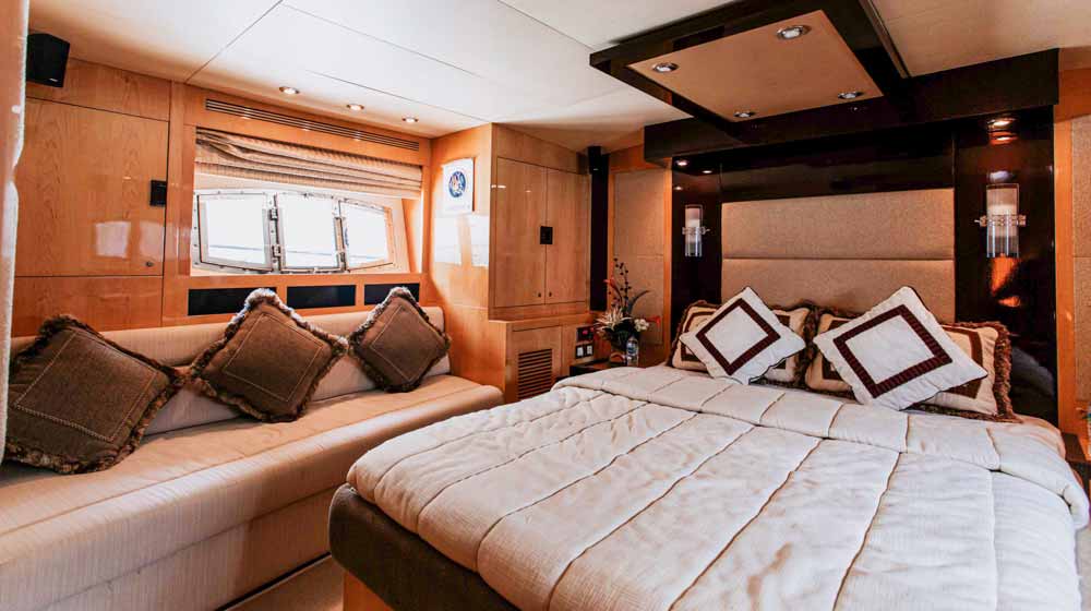 Luxurious suite with large bed, oversized headboard, side windows, side seating and good interiors